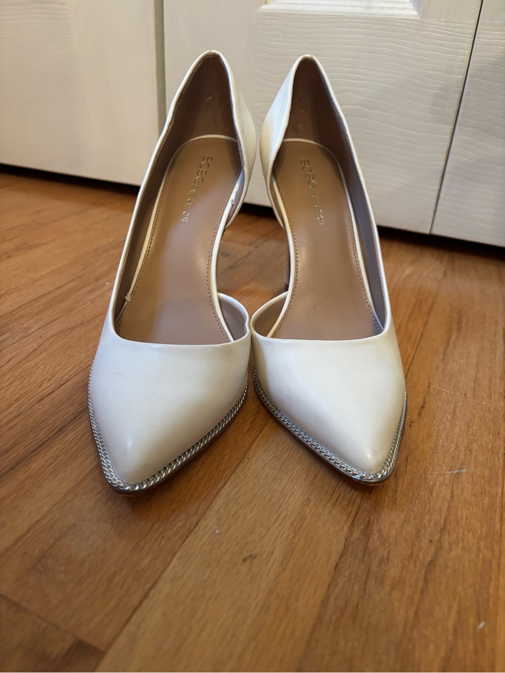 BCBGeneration White Pointed D'Orsay Pumps with Silver Trim